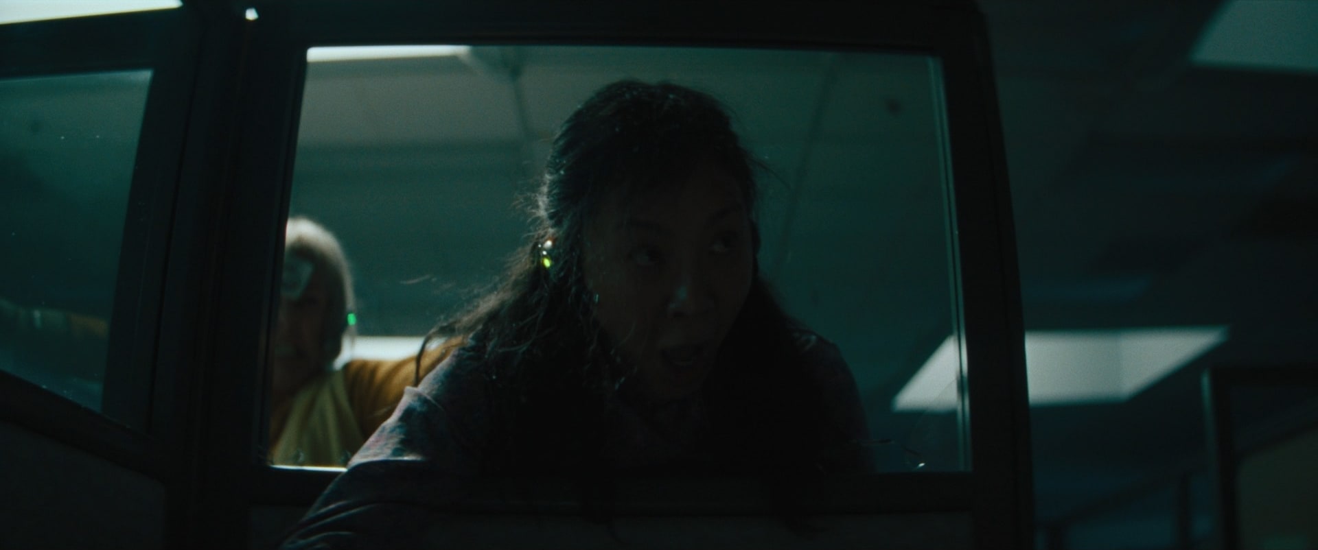 Orange and blue man at computer